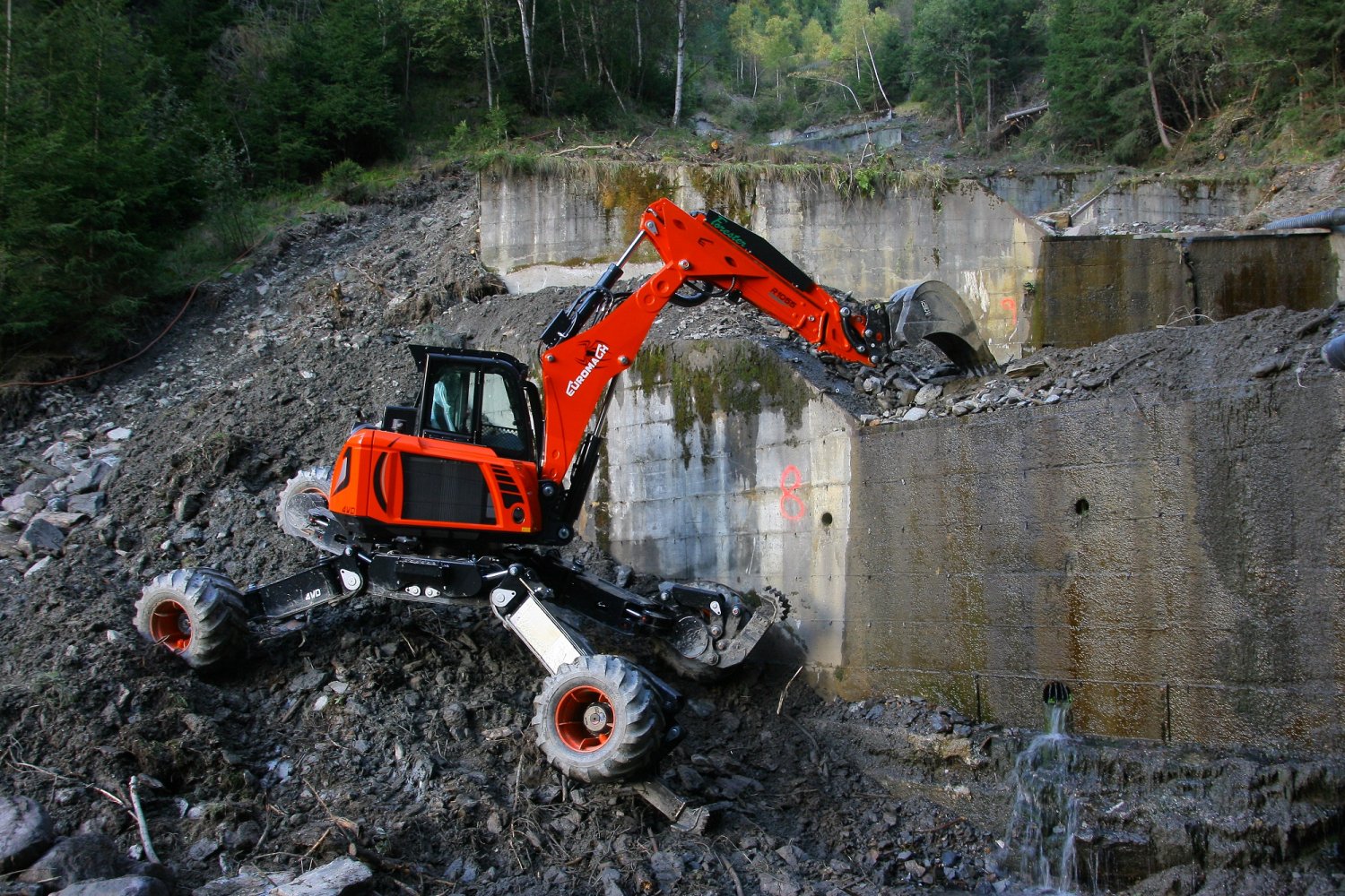 Robotic spider excavator performing canal desilting